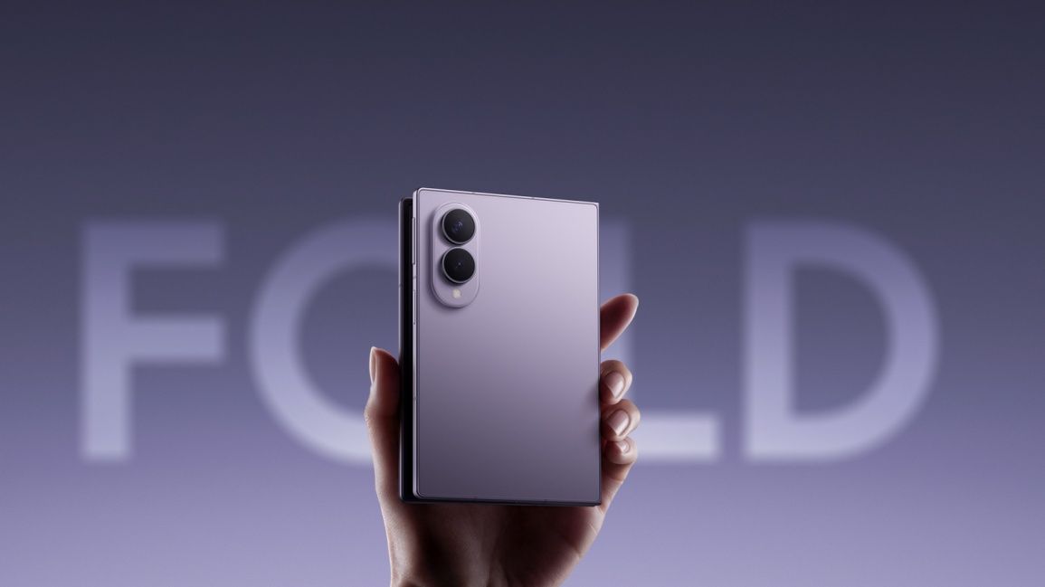 a user holding samsung galaxy z fold 8 in hand and showing the back side a user holding samsung galaxy z fold 8 in hand and showing the back side