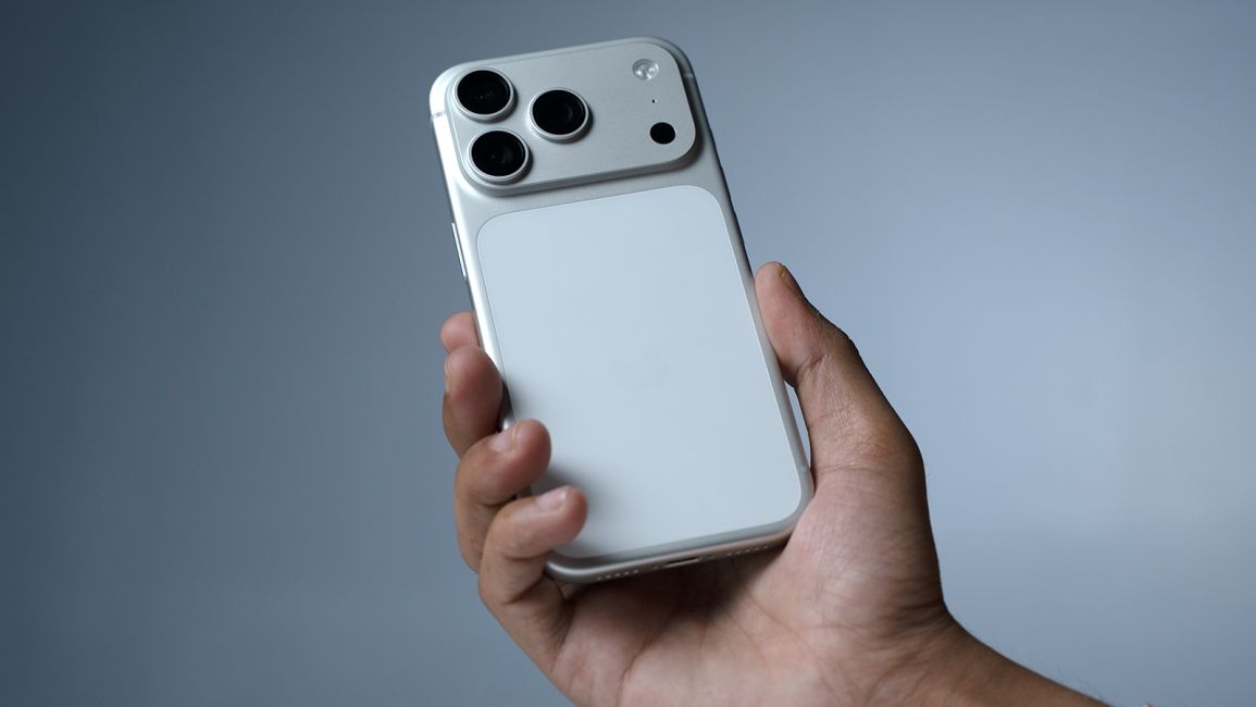 a user holding iphone 17 pro white in hand a user holding iphone 17 pro white in hand