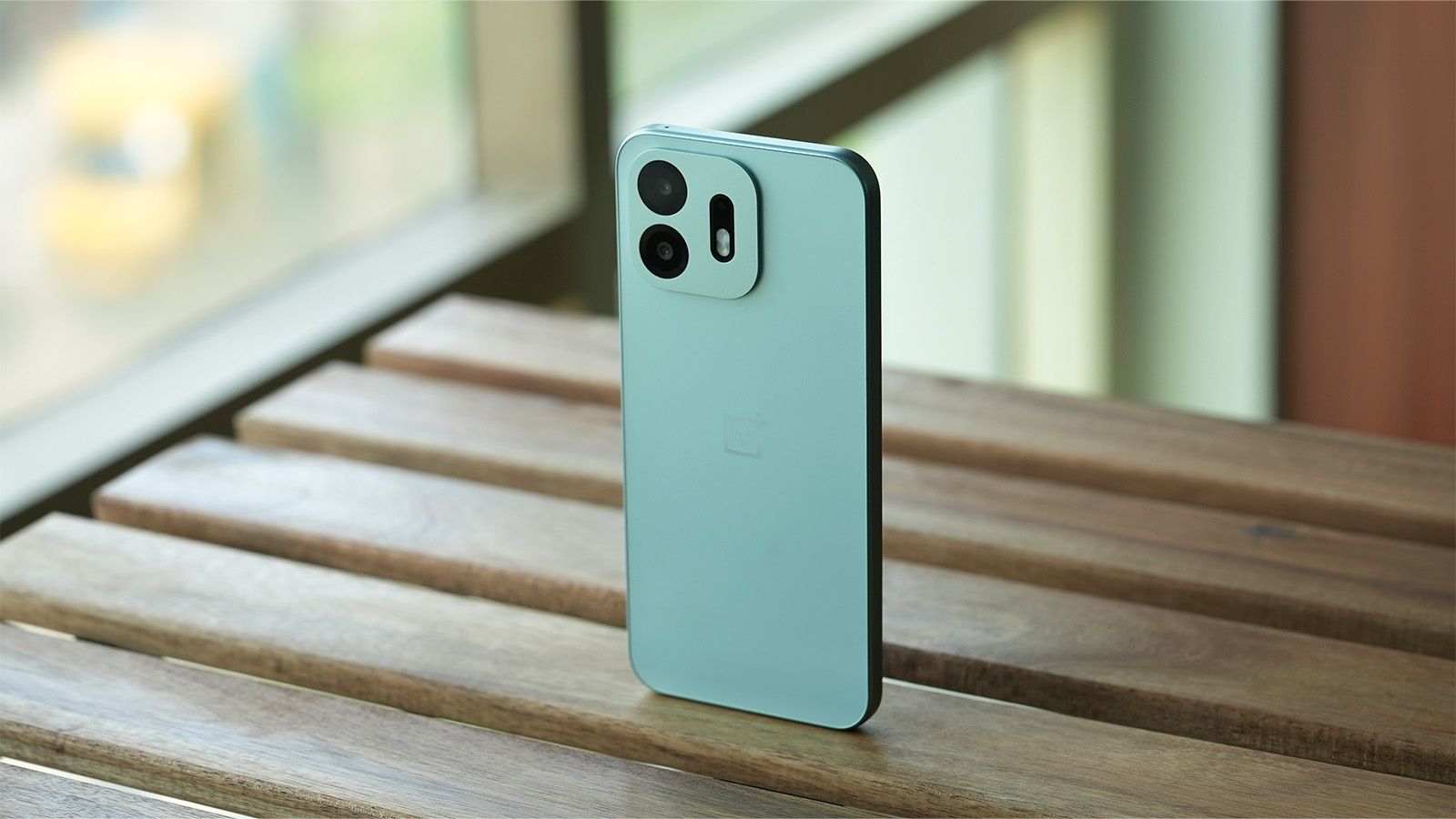 shot of OnePlus N6 Standing on a wooden desk shot of OnePlus N6 Standing on a wooden desk