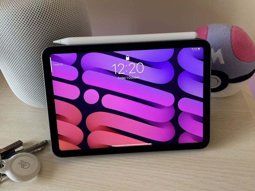 Apple Pencil magnetically snapped on top of an iPad