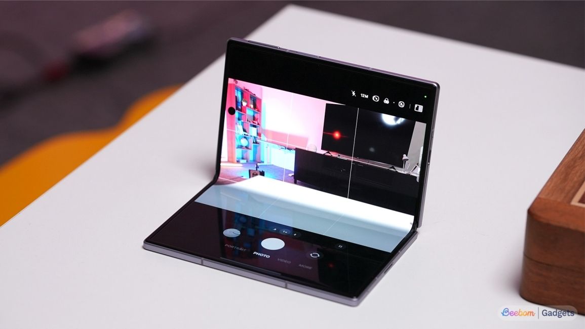 Galaxy Z Fold 8 camera app opened when the phone is semi folded on a white table 