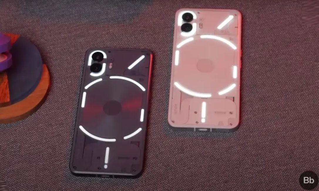 Nothing Phone 2 white and black colour variant with Glyph lights turned on from the back