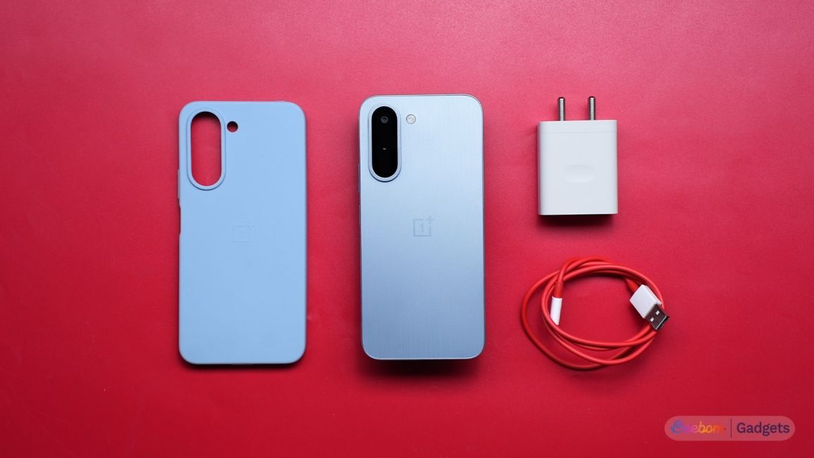 OnePlus N6x box content laid out on a red background
