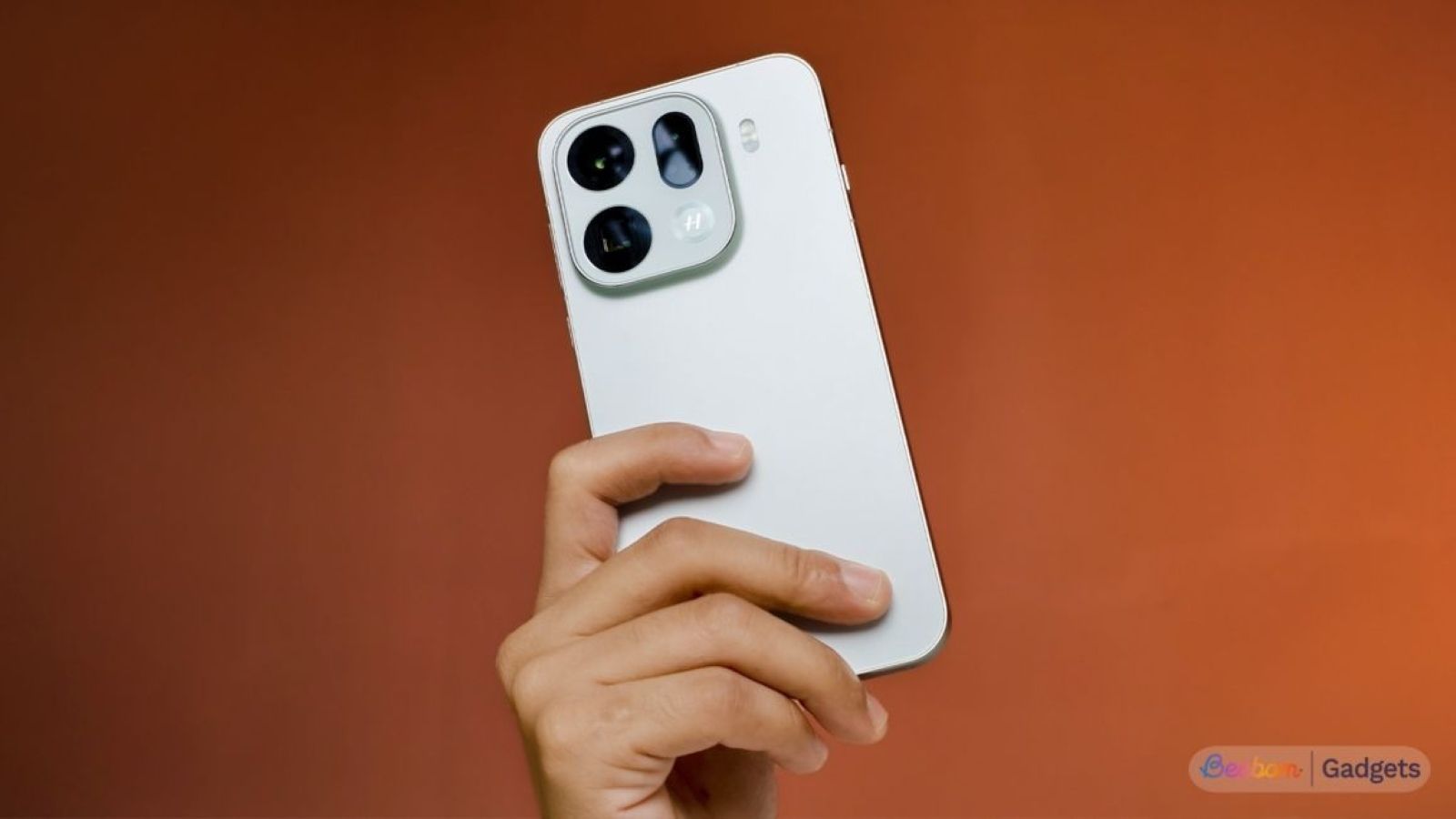 Oppo Find X9 Pro held in hand from the back