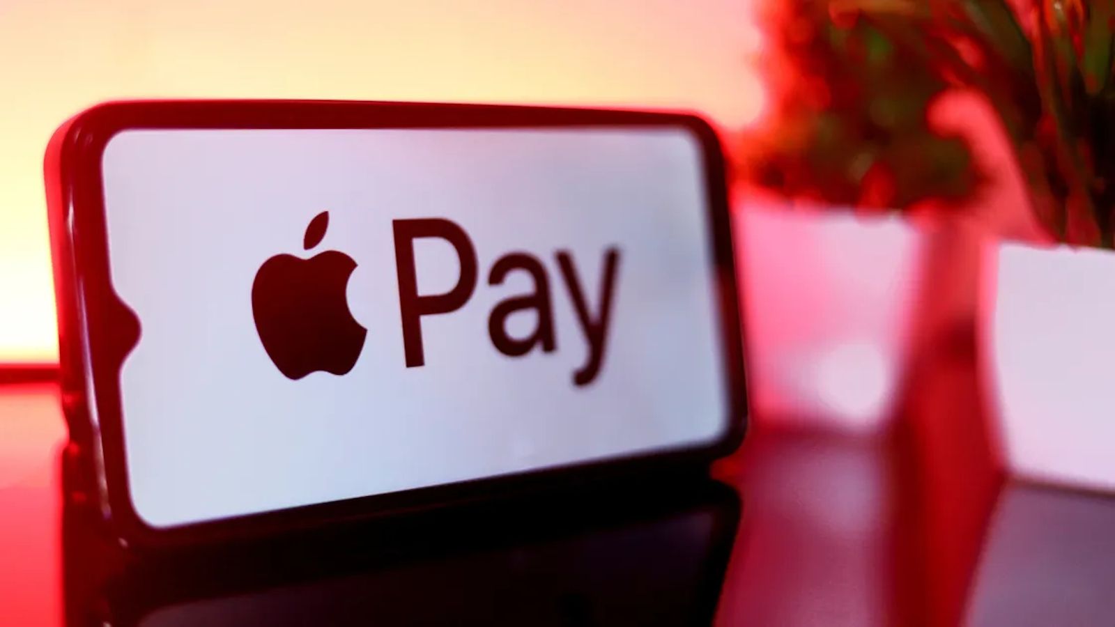 Apple Pay logo open on an iPhone screen Apple Pay logo open on an iPhone screen