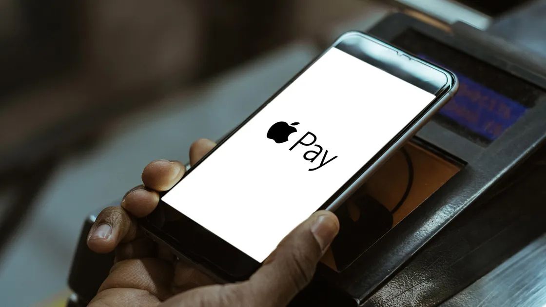 Apple Pay UPI support showcased via a phone being used at a tap-to-pay machine Apple Pay UPI support showcased via a phone being used at a tap-to-pay machine