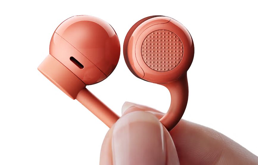 CMF Clip Pro orange colourway earbuds design showcased while it's in hand CMF Clip Pro orange colourway earbuds design showcased while it's in hand