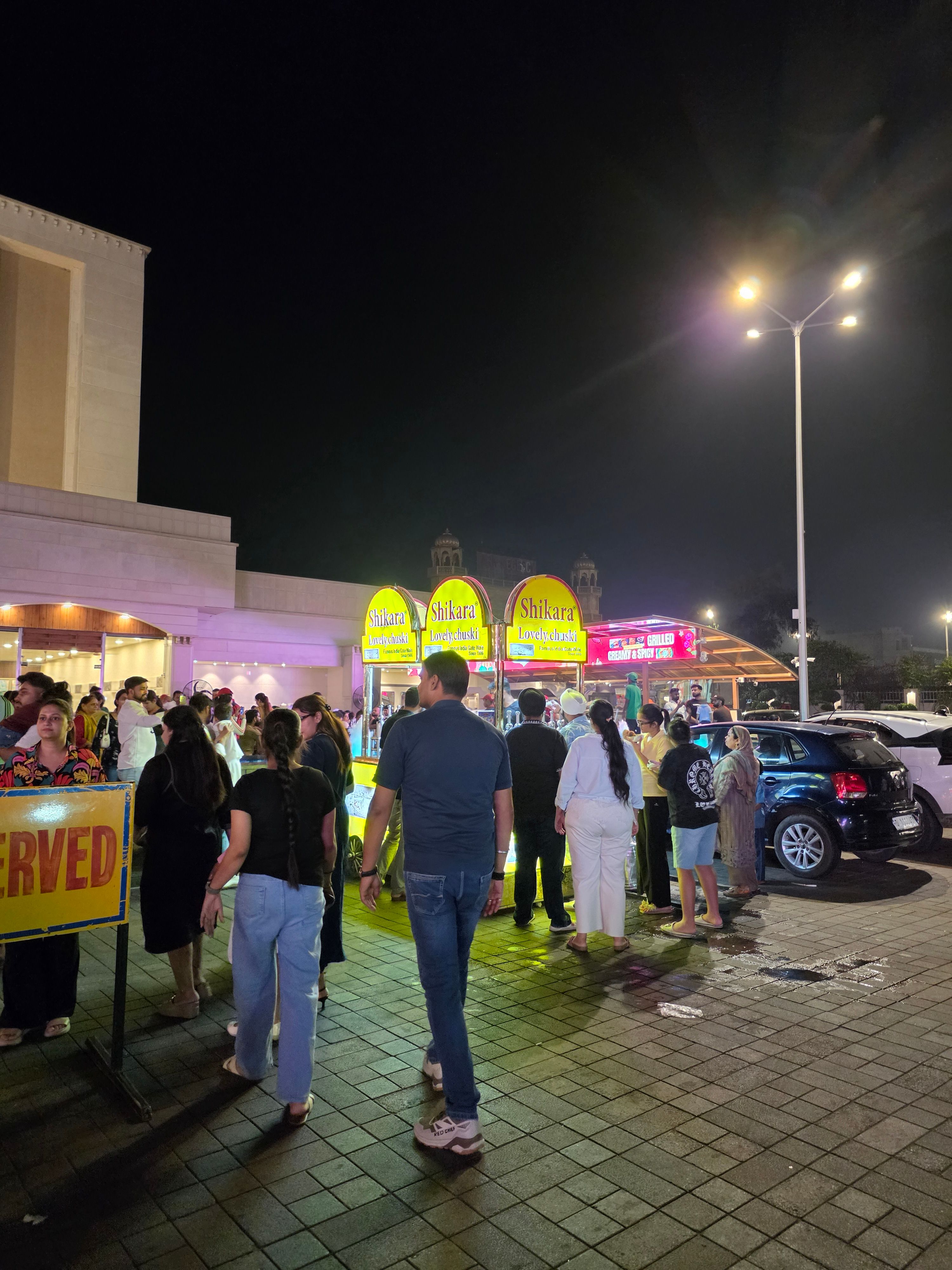 Galaxy Z Fold 8 Ultra main camera night time shot of street shops