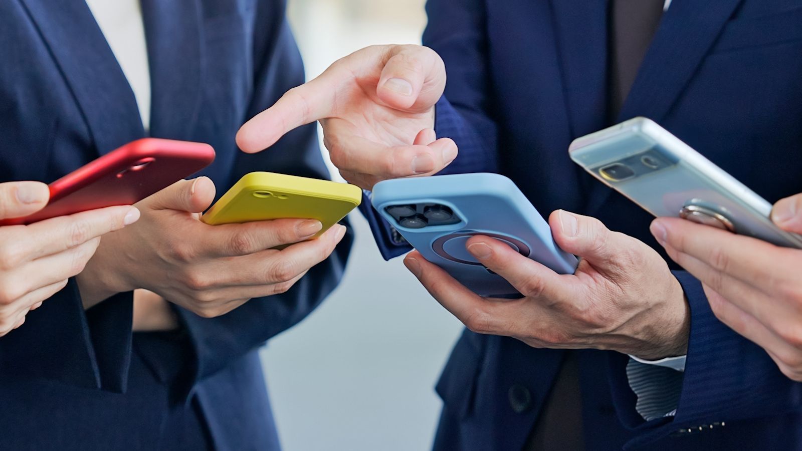 multiple people holding phones in their hands multiple people holding phones in their hands