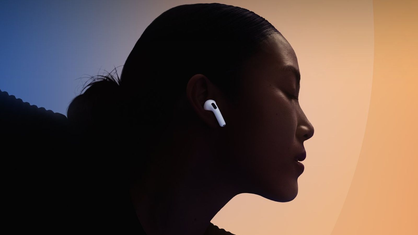 A woman wearing Apple AirPods 5