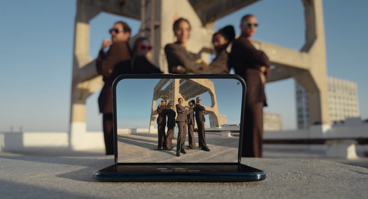 Front view of Apple iPhone Duo taking a group shot