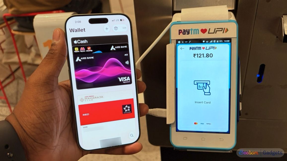 shot of an iPhone showing Apple Pay app making a transaction at a payment counter