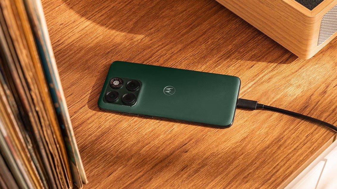 Motorola Edge 70 Plus in green from the back plugged in