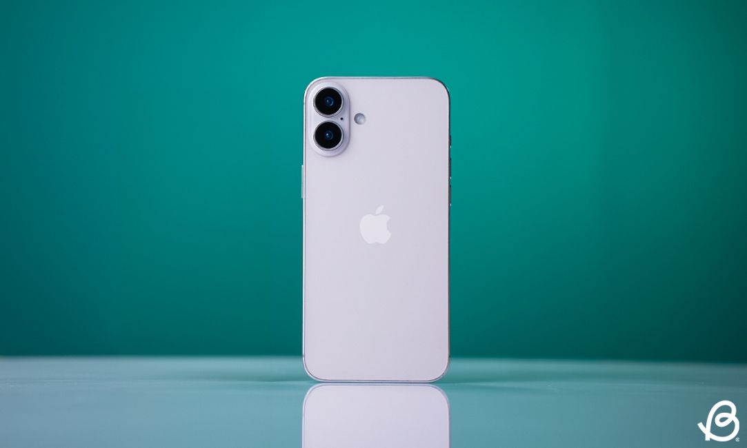 shot of an iPhone 16 Plus standing upright on a desk