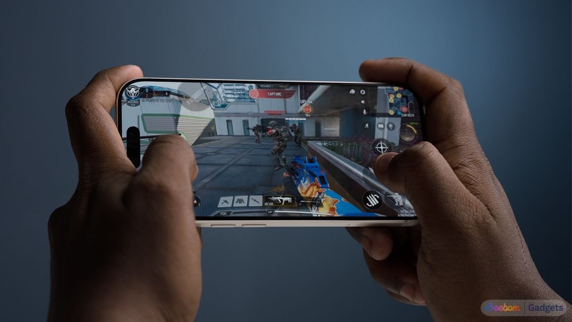 shot of hands holding an iPhone 17 Pro while gaming on it