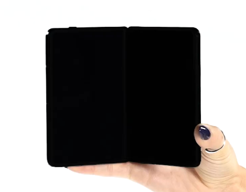 Motorola wide Razr fold in hand while unfolded