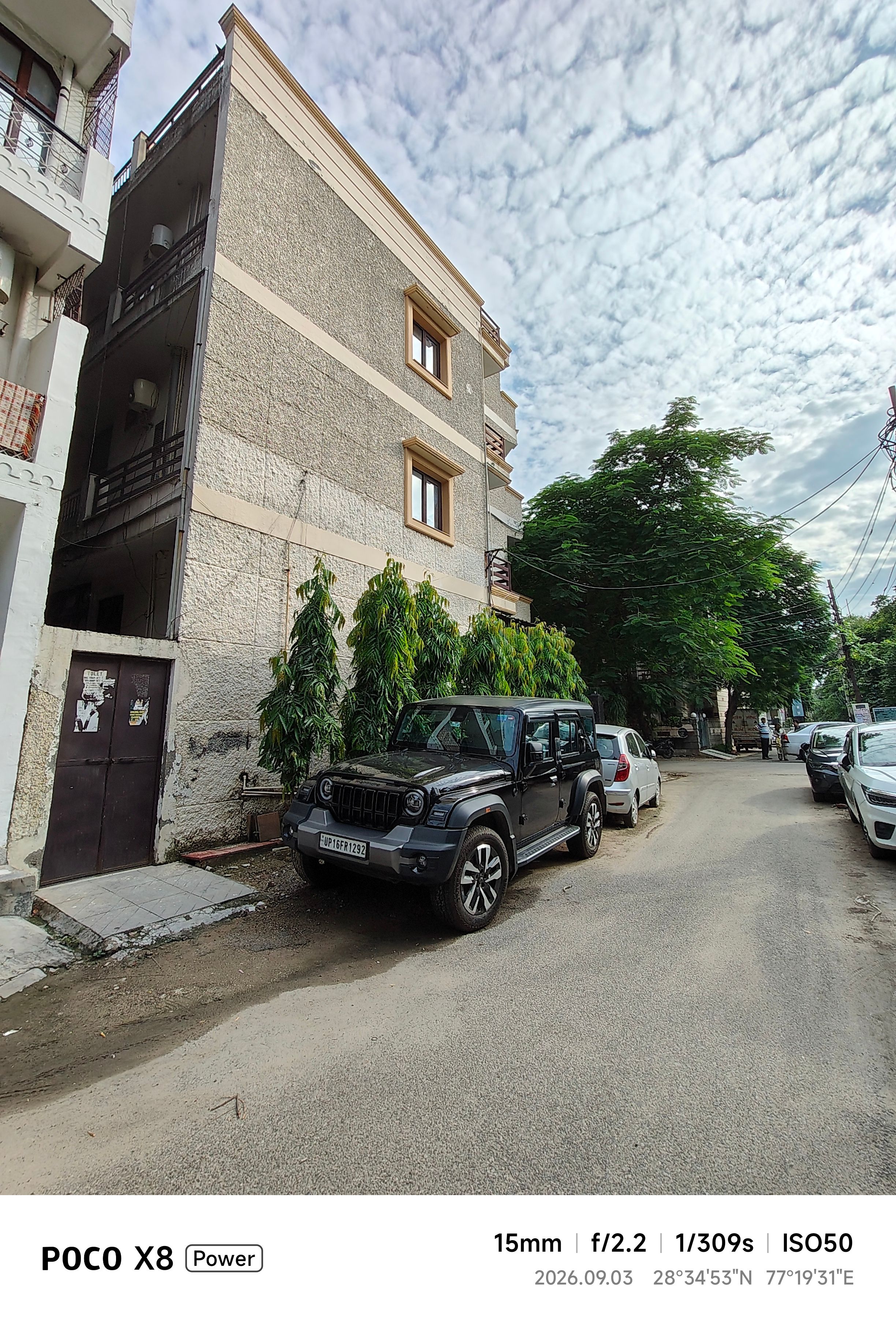 Poco X8 Power car ultrawide shot during the day showcasing