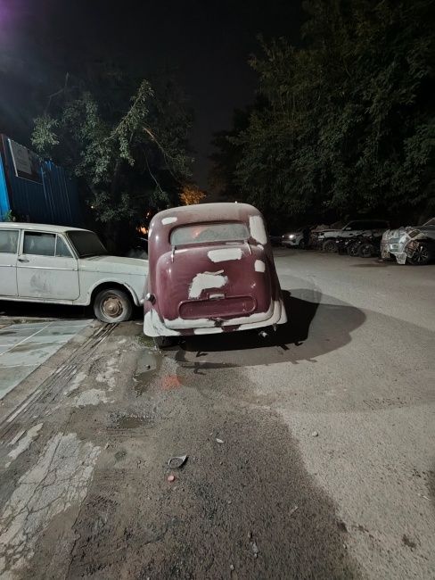 Image of maroon vintage car at night shot on Redmi Note 17 Pro max ultra-wide camera