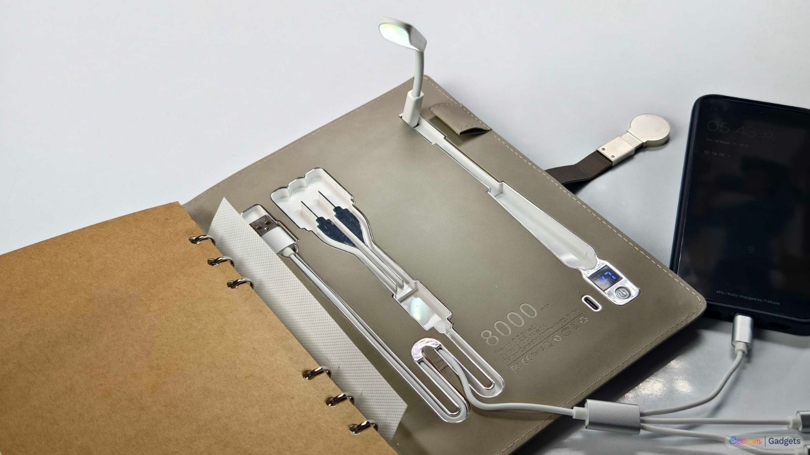 Smart Notebook power bank and charging a phone