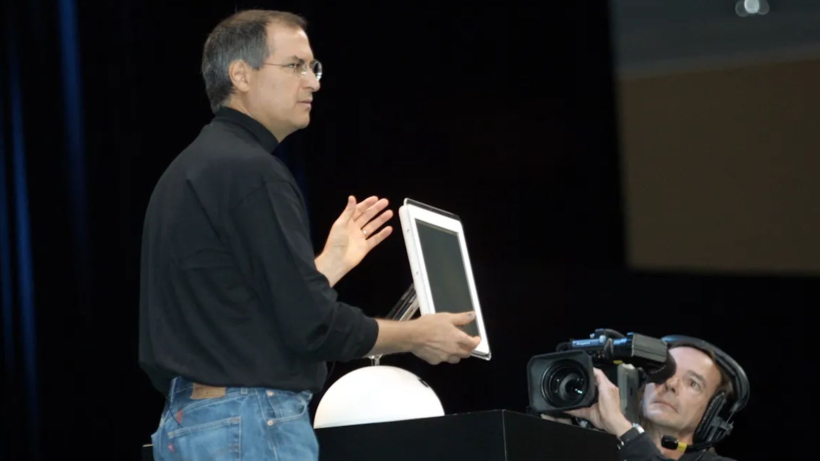 Steve Jobs unveiling iMac G4 on stage