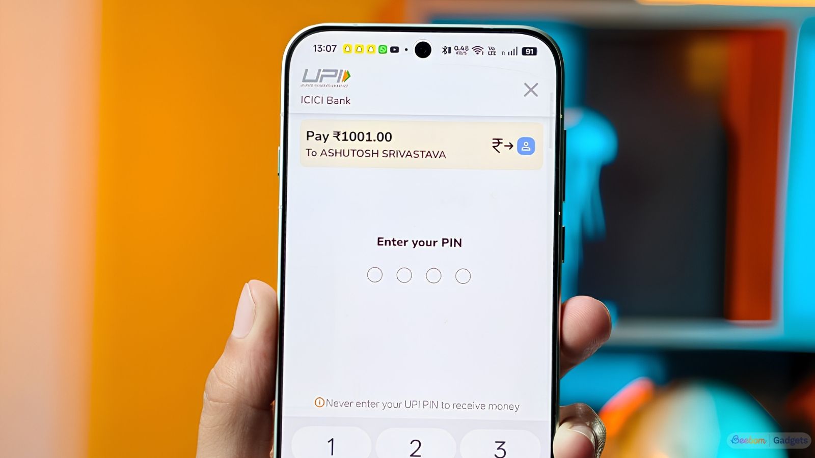 Someone making an UPI payment on Google Pay