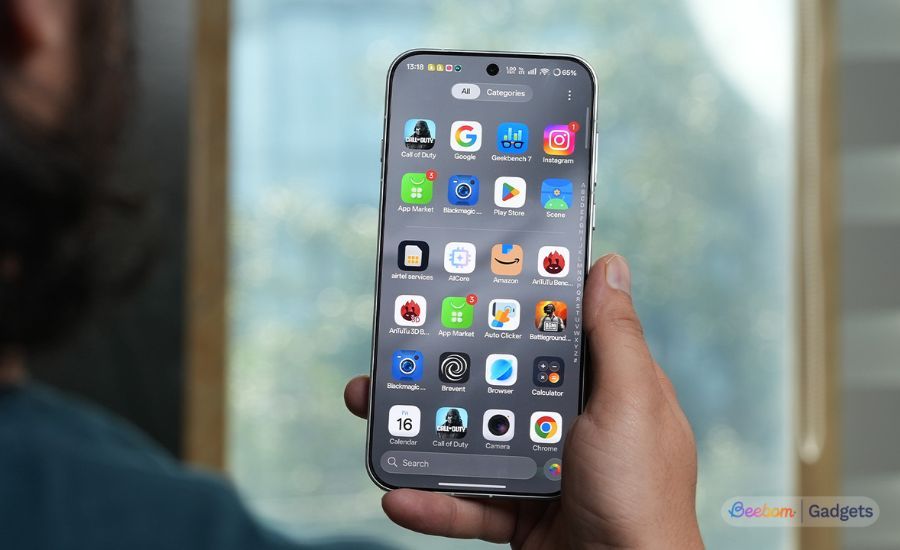 Oppo Find X10 Pro Max held in hand from the front with app menu opened Oppo Find X10 Pro Max held in hand from the front with app menu opened