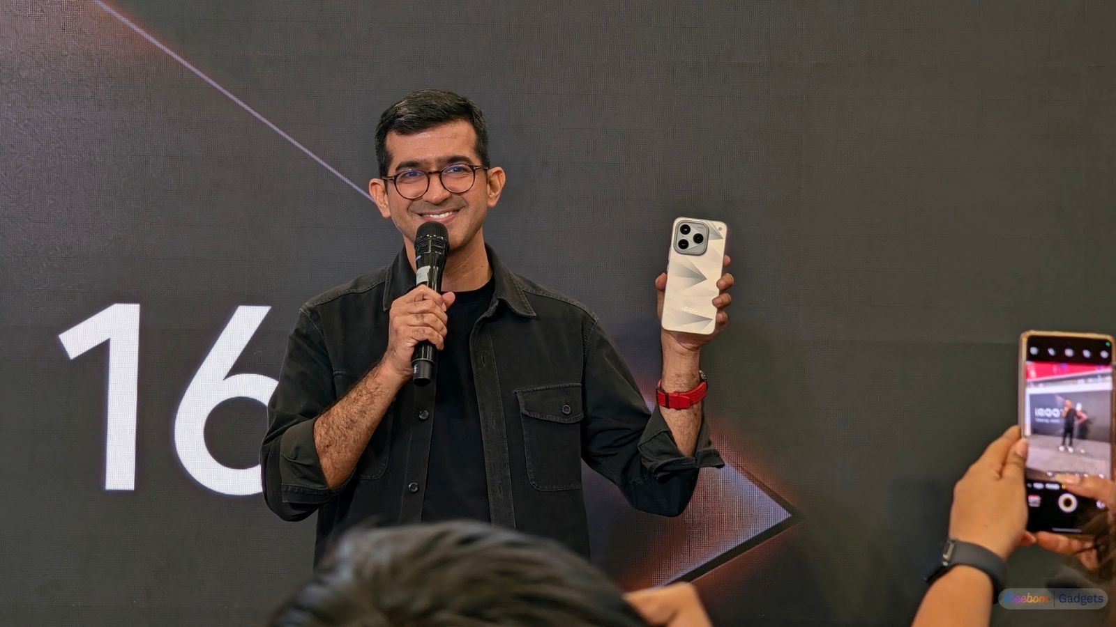 iQOO India CEO Nipun Marya holding the iQOO 16 in hand