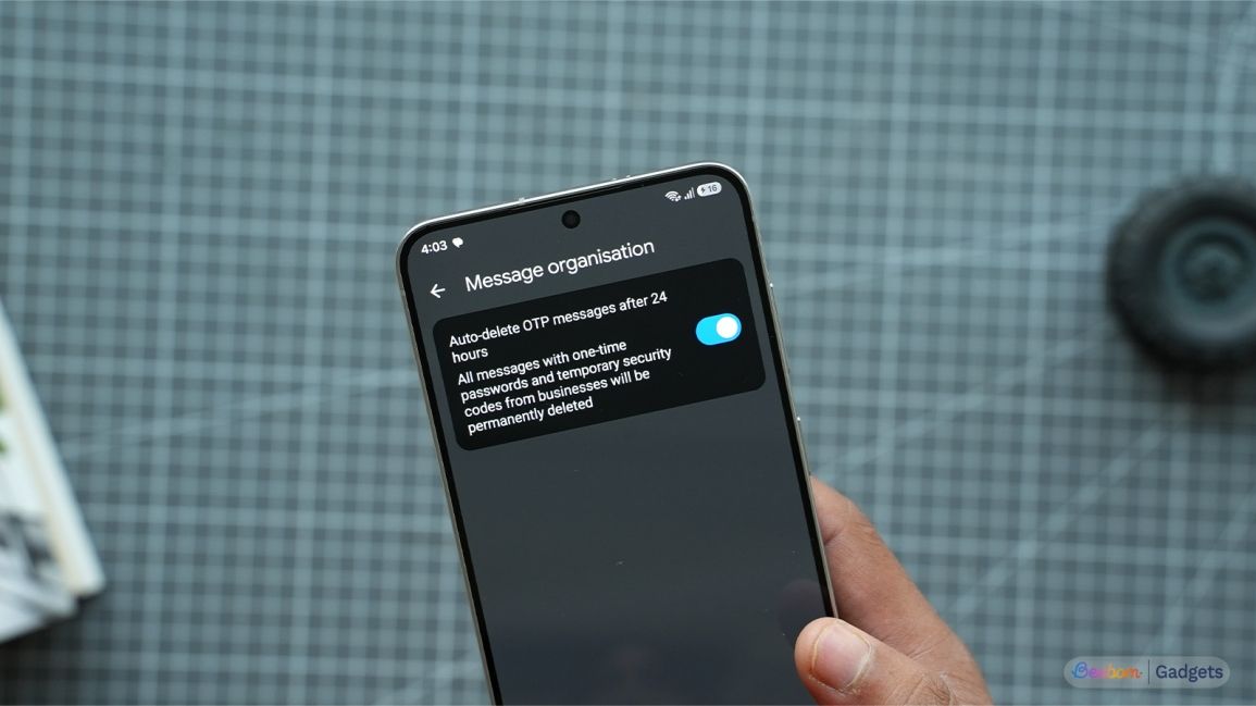 a user holding an android phone showing message organisation setting in google messages