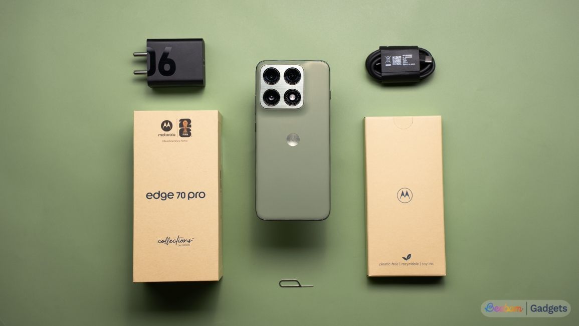 Motorola Edge 70 Pro in green on the table with box contents laid out