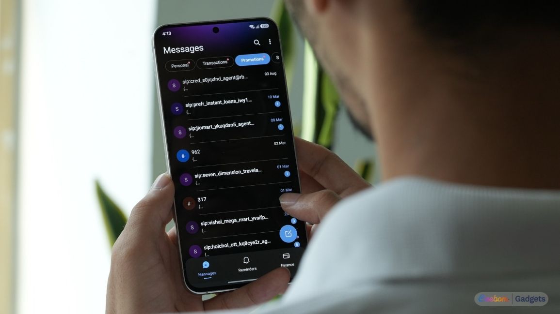 a user holding an android phone showing sms organizer message categorisation
