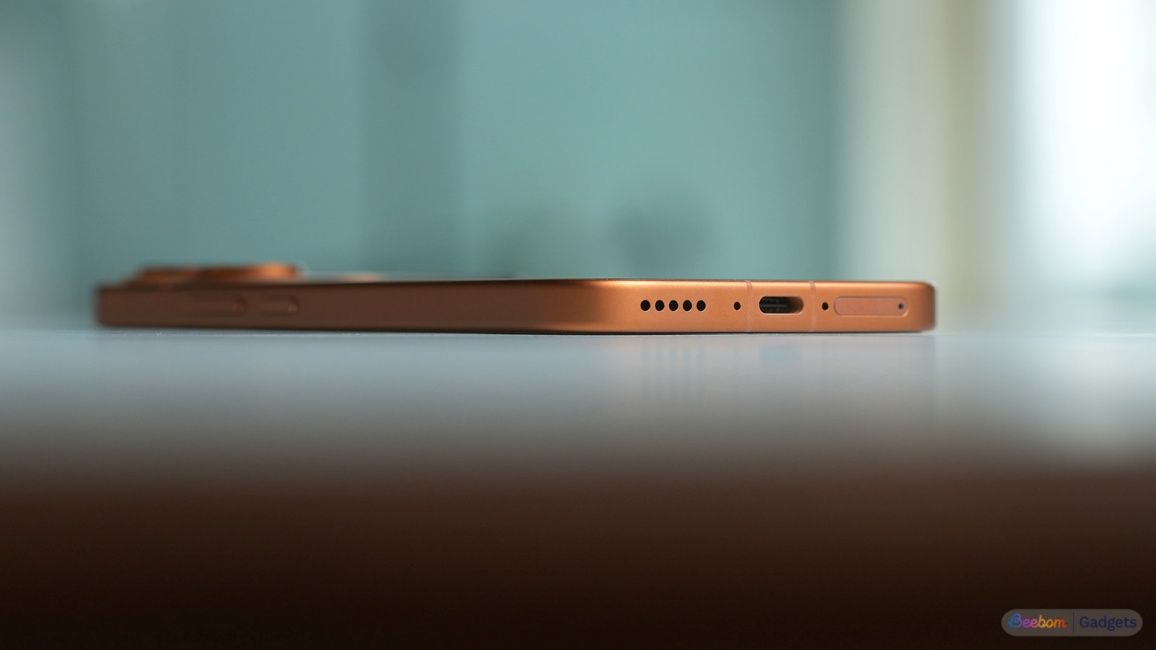 Bottom view of the Vivo V80 with charging port and speaker grill