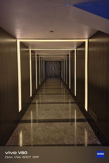 Image of a long well lit hallway shot on Vivo V80