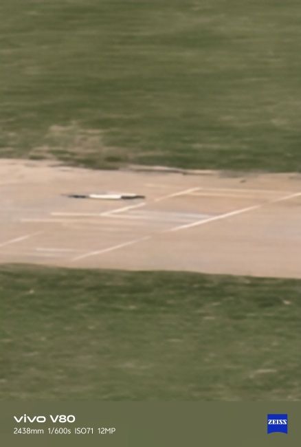Extreme zoom shot of cricket pitch captured on Vivo V80's telephoto camera