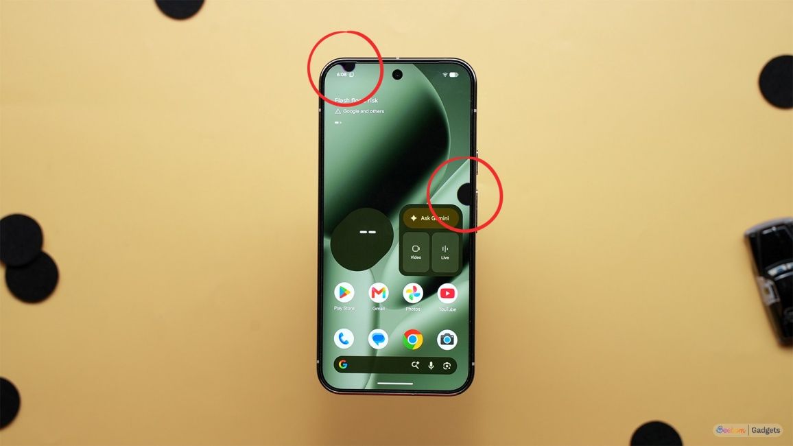 Top-down shot of a phone with black dots on screen